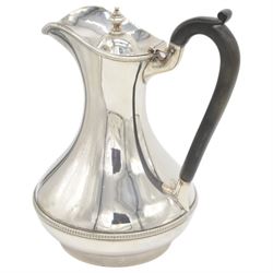 1930s silver hot water pot, of bellied form engraved with monogram to body, with Bakelite type handle and urn finial, hallmarked Fattorini & Sons Ltd, Birmingham 1938, H23cm