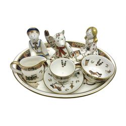 Royal Crown Derby Treasures of Childhood cabaret set, comprising tray, milk jug, sucrier, teacup and saucer, together with two Royal Crown Derby Treasures of Childhood paperweights Fleur and Ragdoll Sailor and Teddy bear paperweight, all paperweights are without stoppers