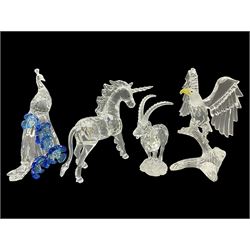 Swarovski Crystal animals, comprising white peacock, the tail with cascading blue flowers, perched eagle with yellow beak, ibex with frosted crystal horns and unicorn with frosted crystal horn, tallest H13cm