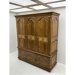 Barker and Stonehouse mango wood and flagstone triple wardrobe, three doors above four drawers and single cupboard