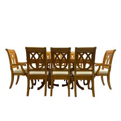 Yew wood extending twin pedestal dining table, rectangular top with ebony stringing over turned and reeded vasiform pedestals on tripod bases, with two additional leaves (W159cm D92cm); and set of eight (6+2) matching dining chairs, high pierced backs over seats upholstered in ivory fabric, on cabriole supports (W57cm H101cm)
