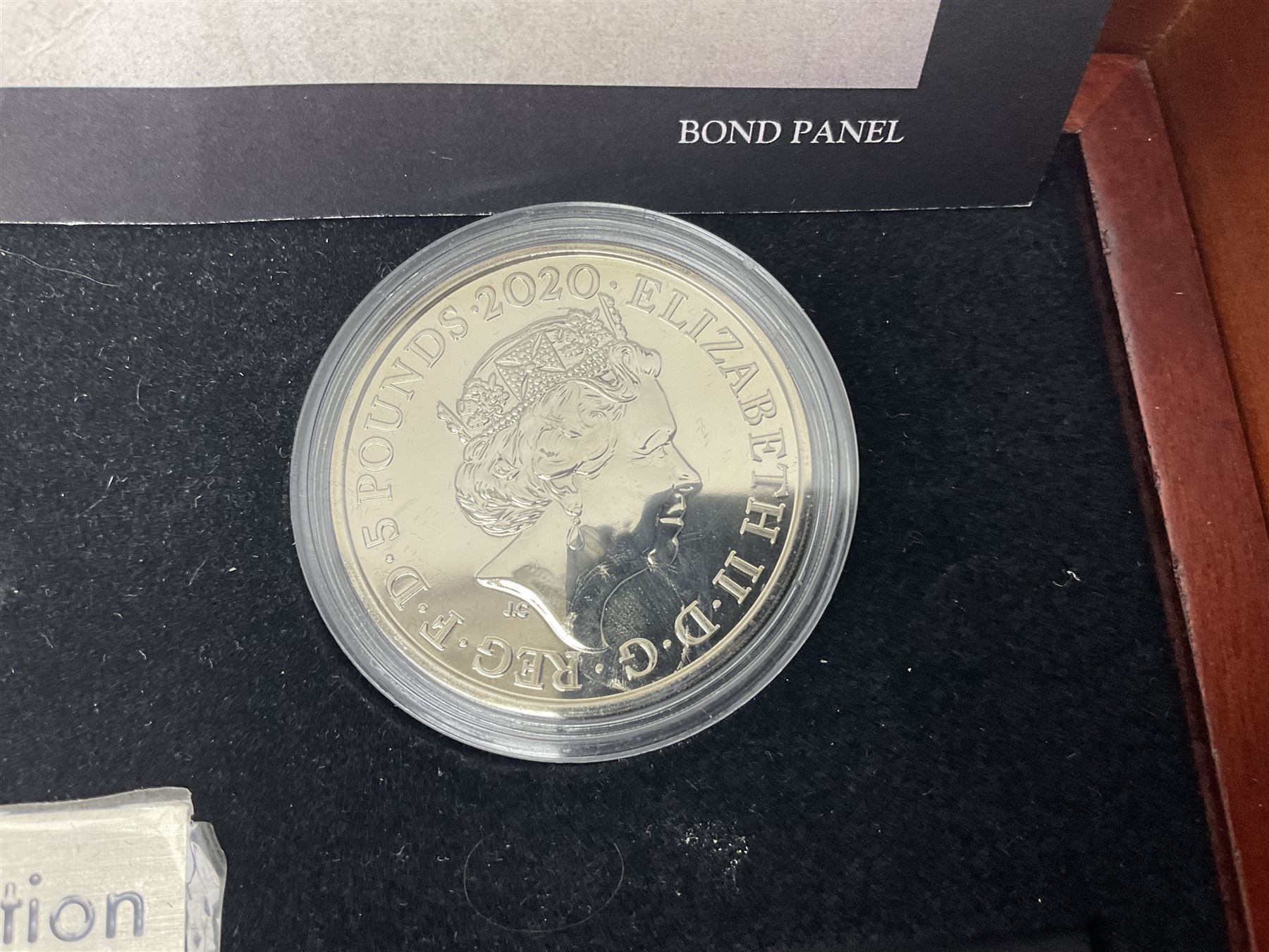 Danbury Mint 'The Ultimate James Bond Collection' comprising stamps and coins housed in a display case, 'Concorde Queen of the Skies' sculpture, stamps, medallion display and 2020 'Centenary of the Unknown Warrior' five pound coin cover in Harrington and Byrne folder