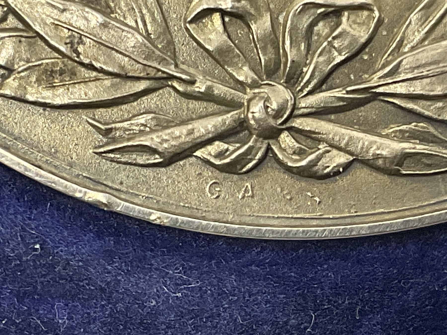 Charles I 1625 hammered silver sixpence, Queen Victoria 1894 crown coin and a cased hallmarked silver medal for the Hull photographic society, engraved '1940' 'Leonard Vokes', all housed in a red Pobjoy Mint coin box