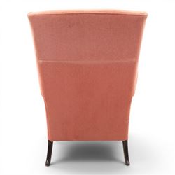 Parker Knoll - mid-century armchair suite, 'Model N30' recliner armchair with headrest and deep buttoned seat and back raised on castors, a wide armchair with deep button back and seat raised on castors, a wingback chair with flared scrolled arms, raised on cabriole supports