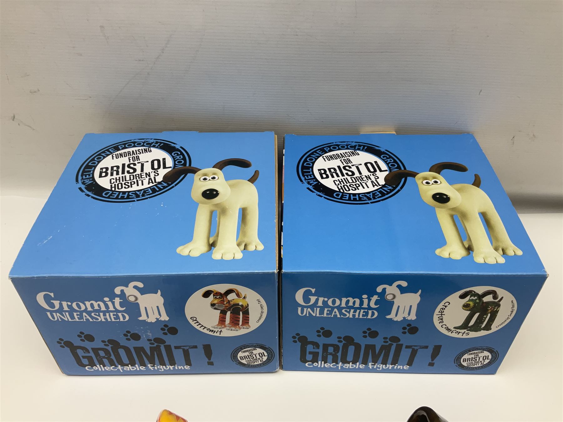 Wallace & Gromit - Gromit Unleashed: two Aardman Animations The Grand Appeal 'Gromit Unleashed' figures comprising Grrrrromit and Creature Comforts, both with boxes