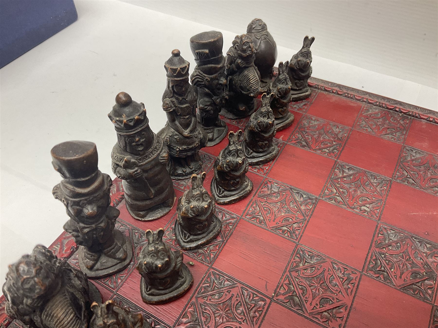 Alice in Wonderland themed chess set, with a complete set of composite figures, modelled as characters including Alice, Tweedledum and Tweedledee, the White Rabbit and the Mad Hatter, etc