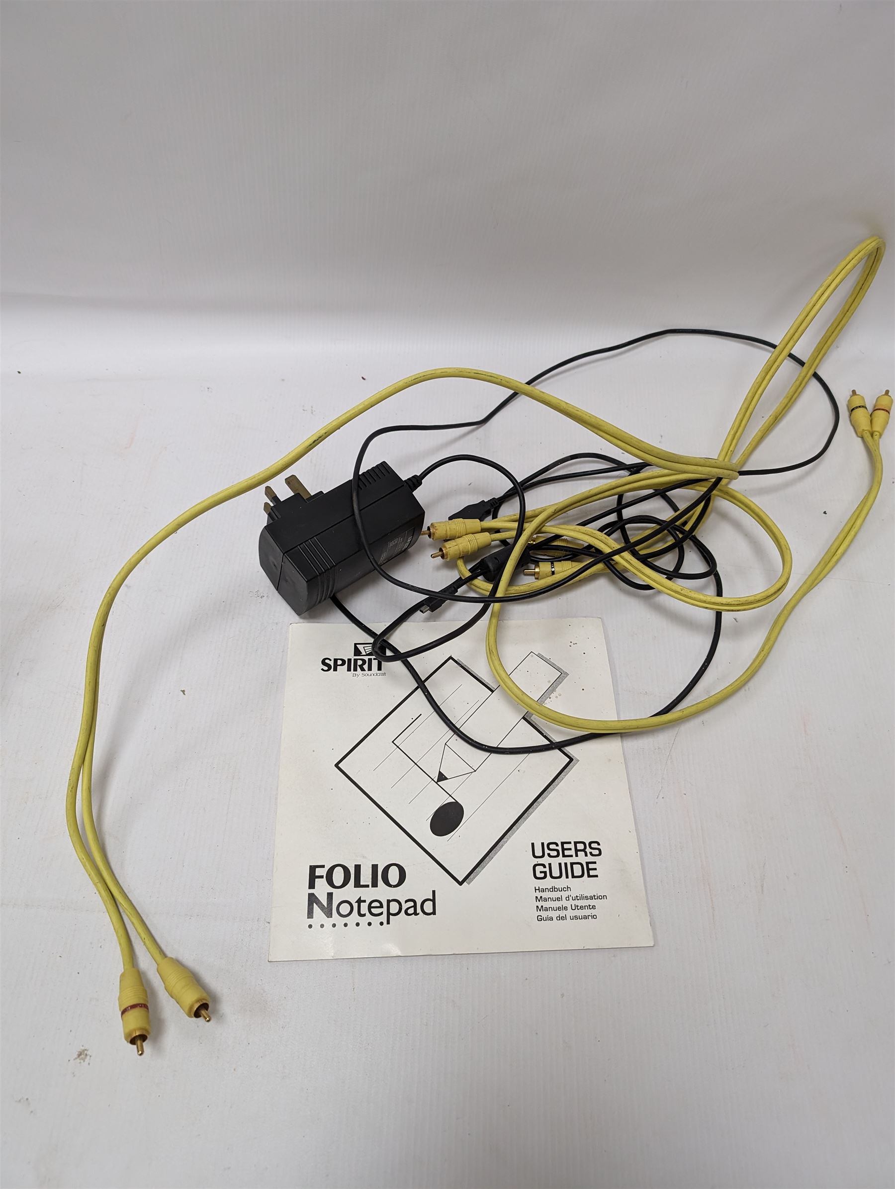 Spirit Folio Notepad mixer, together with a Roland pedal and a Suntech metronome tuner