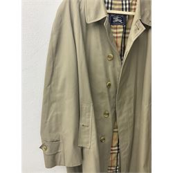 Ladies Burberry double breasted trench coat, with belt and detachable woollen gilet, in traditional cream colour with Burberry check lining, together with a gentlemans Burberry single breasted trench coat, both L112cm