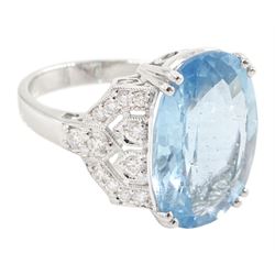 18ct white gold oval cut aquamarine ring, with milgrain set diamond, pierced design shoulders, stamp[ed 750, aquamarine approx 9.65 carat, total diamond weight approx 0.45 carat