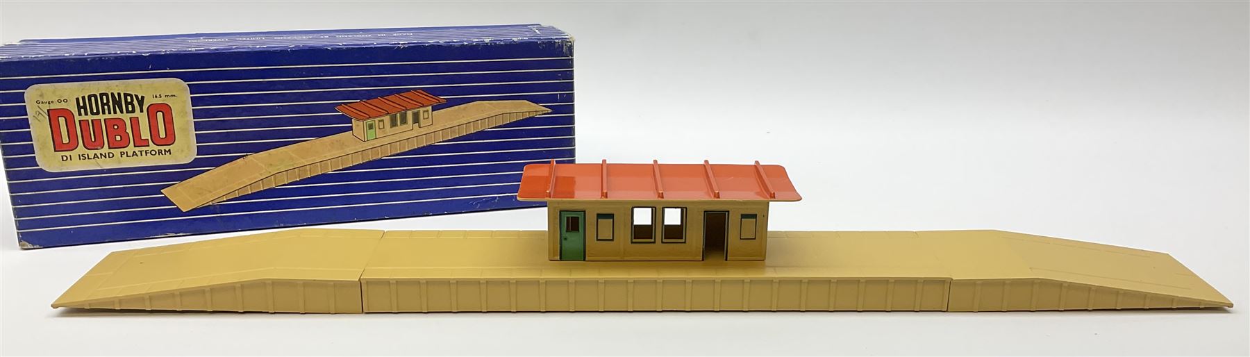 Hornby Dublo - six D1 accessories comprising Turntable; Through Station with white edges and separately boxed Platform Extension with Wall; Signal Cabin with orange roof and pack of station names; Level Crossing; and Island Platform; all boxed (6)