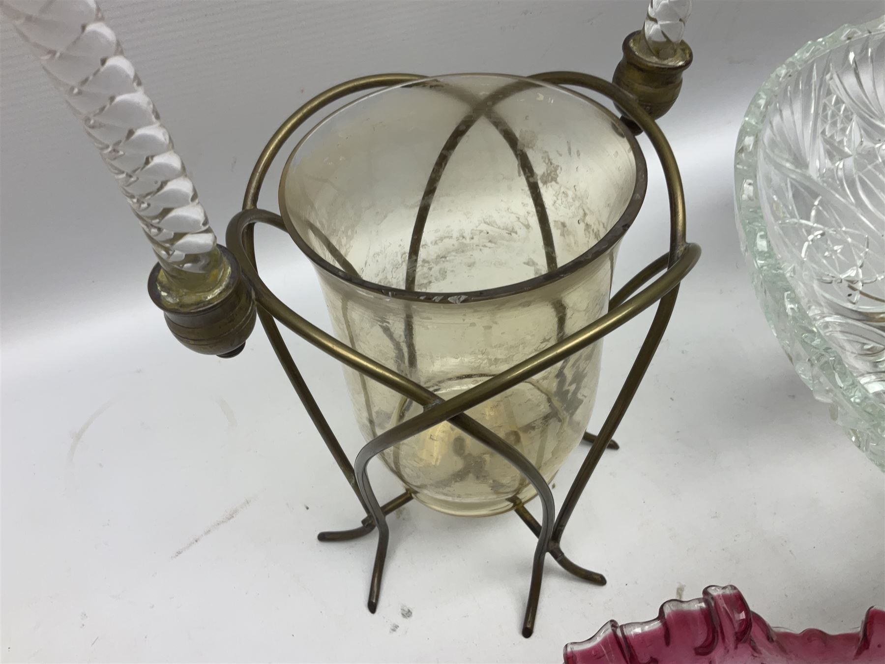 20th century moulded glass and gilt centre piece bowl with carrying handle and ornate trefoil base, together with frilled cranberry edge glass comport with ornate gilt base, and further centre piece with  large glass handle of twisted form, tallest H54cm