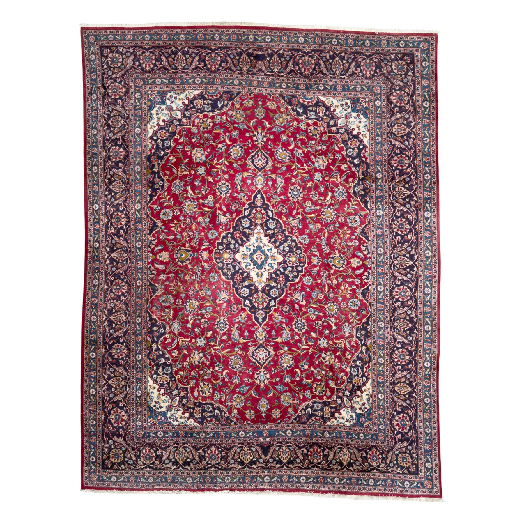 Pair of Persian wool rugs, each with rich red ground, one centred with a diamond-shaped medallion and navy spandrels within a floral field, the other with radiating floral medallion and scrolling foliate motifs, both enclosed by multiple borders with palmette and flowerhead designs, from the region of Kashan 291x376, 299 x 378 