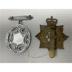 WW2 group of four medals comprising 1939-1945 War Medal, Defence Medal, Italy Star and 1939-1945 Star; with Royal Army Service Corps cap badge and RASC chrome and enamel sweetheart brooch