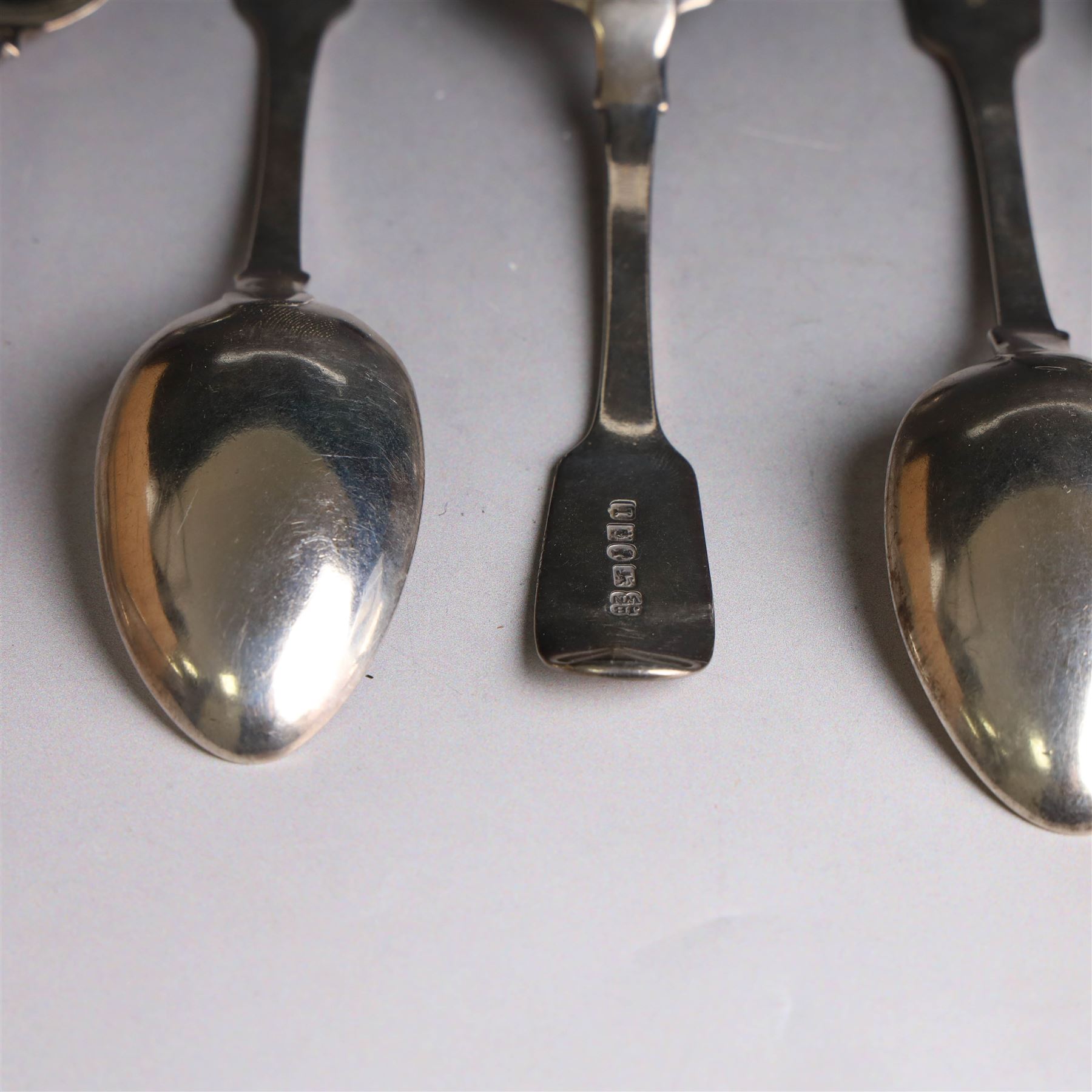 Eight Victorian silver Fiddle pattern dessert spoons, all with engraved initials to terminal, including a set of six York silver spoons, hallmarked James Barber & William North, York 1844 