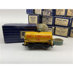 Hornby Dublo - twenty-two wagons including Cattle Trucks; Low-Sided Wagons; Cable Drum Wagon; Tank Wagons for Shell Lubricating Oil, Esso,  and Mobil; Mineral Wagon; 20-Ton Bulk Grain Wagon; Goods Brake Vans; Salt Wagon; Ventilated Van; Bogie Bolster Wagon; High Capacity Wagon; Horse Box; Meat Van; Tube Wagon etc; all in blue striped boxes (22)