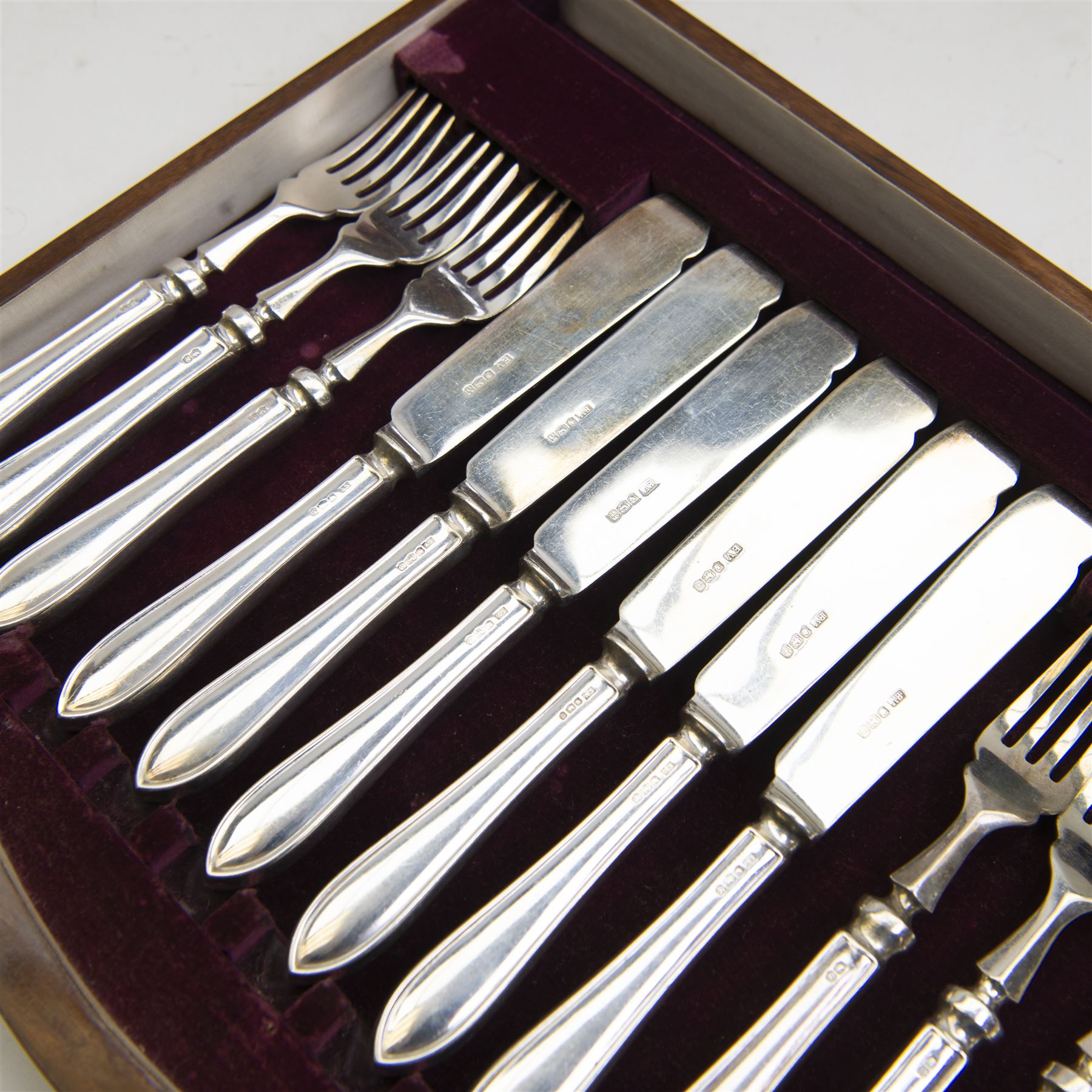 Mid 20th century silver canteen of Sandringham pattern cutlery for six place settings, comprising table spoons, table forks, silver handled table knives with stainless steel blades, dessert spoons, dessert forks, silver handled dessert knives with stainless steel blades, teaspoons, coffee spoons, silver handled fish knives and fish forks with silver blades, hallmarked Viner's Ltd, Sheffield 1955, contained in a wooden canteen with single drawer