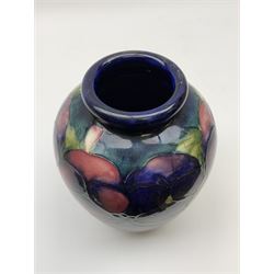 Moorcroft vase of ovoid form, decorated in Pansy pattern upon a dark blue ground, with impressed and painted marks beneath, H16.5cm. 