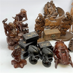  A selection of carved Eastern and African wooden figures and plaques, together with a set of five Chinese lacquer boxes, and a soapstone carving of a landscape, etc.    