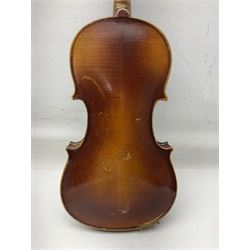 Czechoslovakian violin c1920 with 36cm two-piece maple back and ribs and spruce top, bears label 'Copy of Antonius Stradivarius Made in Czechoslovakia' L59cm; in carrying case; 1950s Czechoslovakian violin; and 195os Czechoslovakian three-quarter size violin; both cased (3)