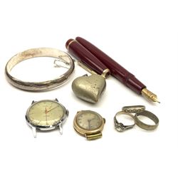 A Parker fountain pen with burgundy resin body and nib marked 14K, together with two rings marked silver, a ring marked 9ct&sil, a silver bangle marked 925, heart shaped pendent marked Alpaca, and two watch faces, one marked to the back 375. 