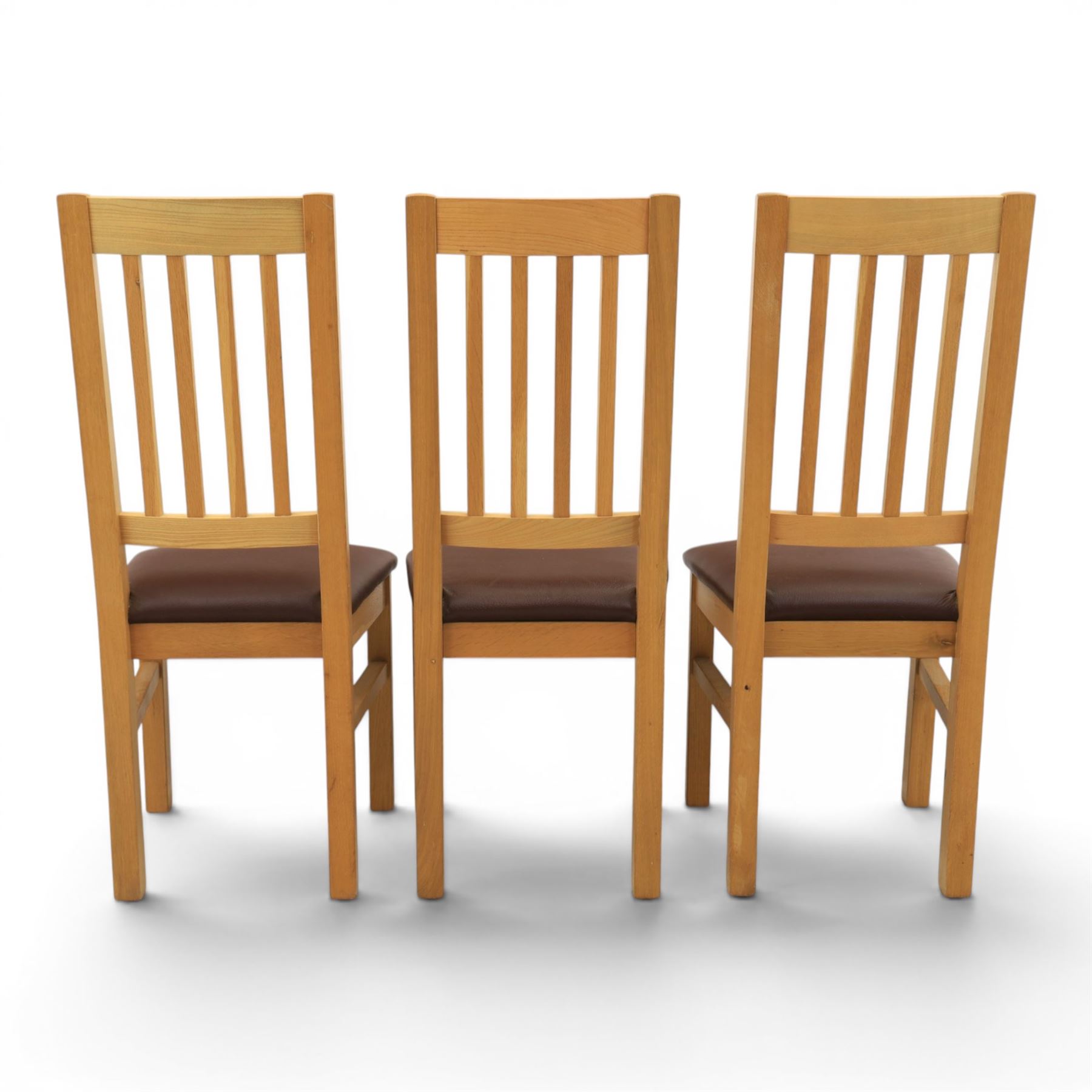 Modern solid oak dining table with set six chairs, chairs with brown leatherette seat