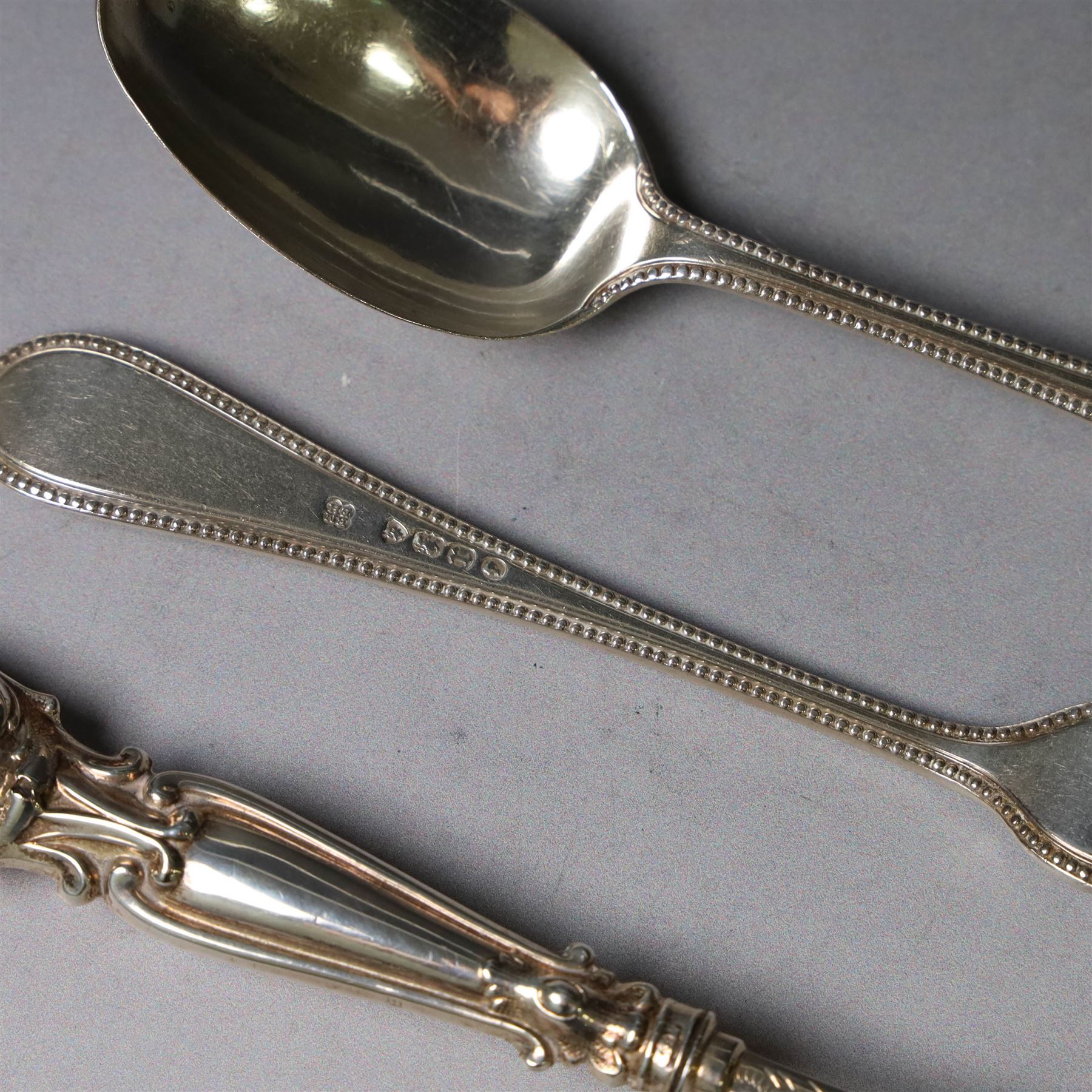 Victorian silver spoon and fork set, each with bead rim and engraved monogram and a silver spoon with scroll handle, with bright cut engraving to underside of bowl, all hallmarked 
