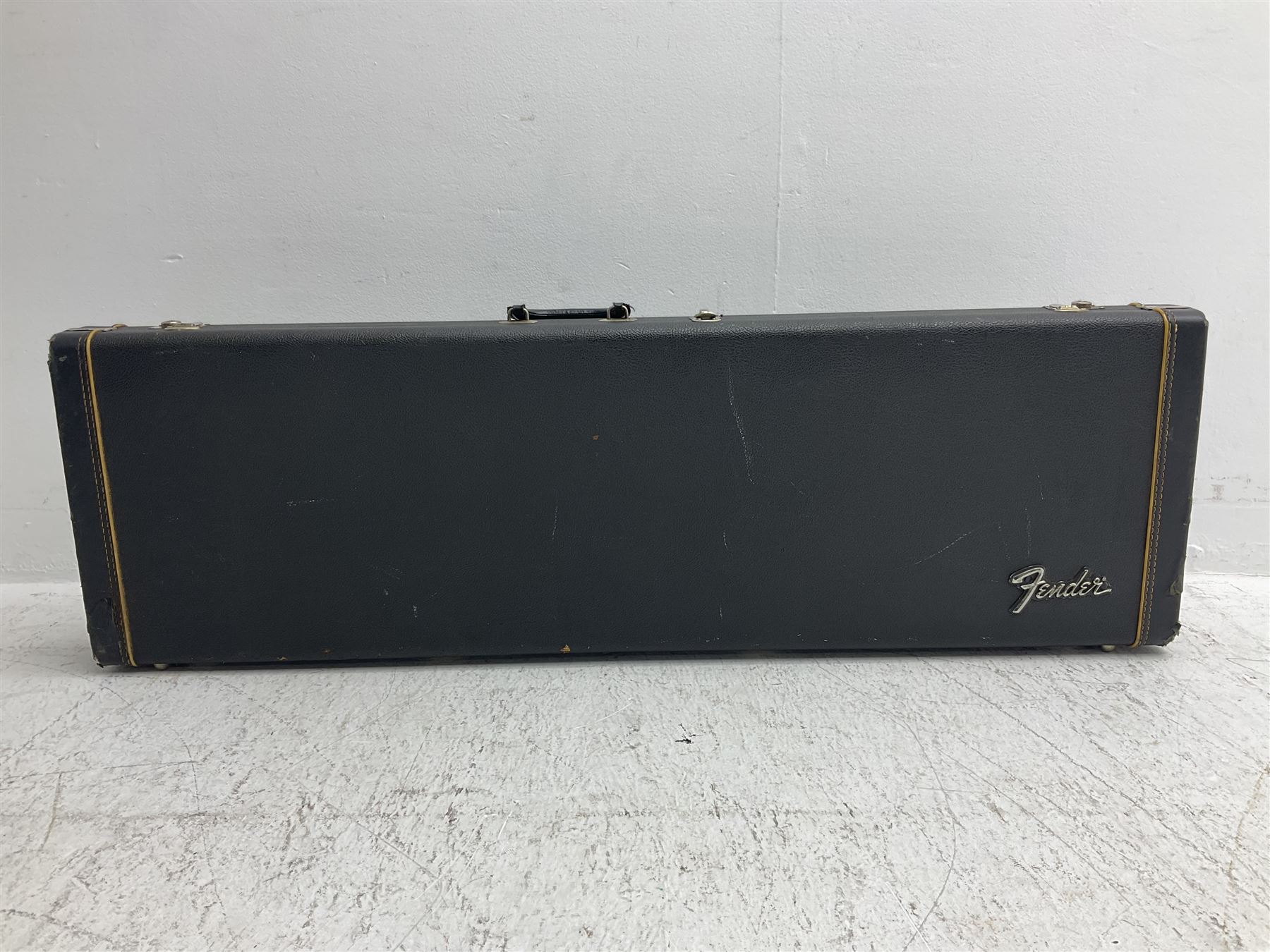 1963 Fender Jazz three-knob bass guitar; impressed with date code 7AUG63A on end of neck and serial no.L08587 on back plate; all original but re-finished in white in the 1970s; sold with photographs of the instrument in the 1960s with original finish and in the 1970s re-finished; L117.5cm; in original hard carrying case; Provenance: the professional guitar of Howard Livett from new to his death in 2005. Howard played in The Humperdincks, the backing group for Englebert Humperdinck, also played in the backing group for Max Bygraves and in the band Hedgehoppers Anonymous. The guitar is also sold with a manuscript letter of provenance from Howard's wife.