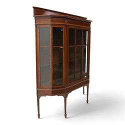 Edwardian inlaid mahogany display cabinet of rectangular canted form, galleried top with crossbanded inlay, above a glazed cabinet enclosing  baize lined shelves, raised on square tapering legs terminating in spade feet  