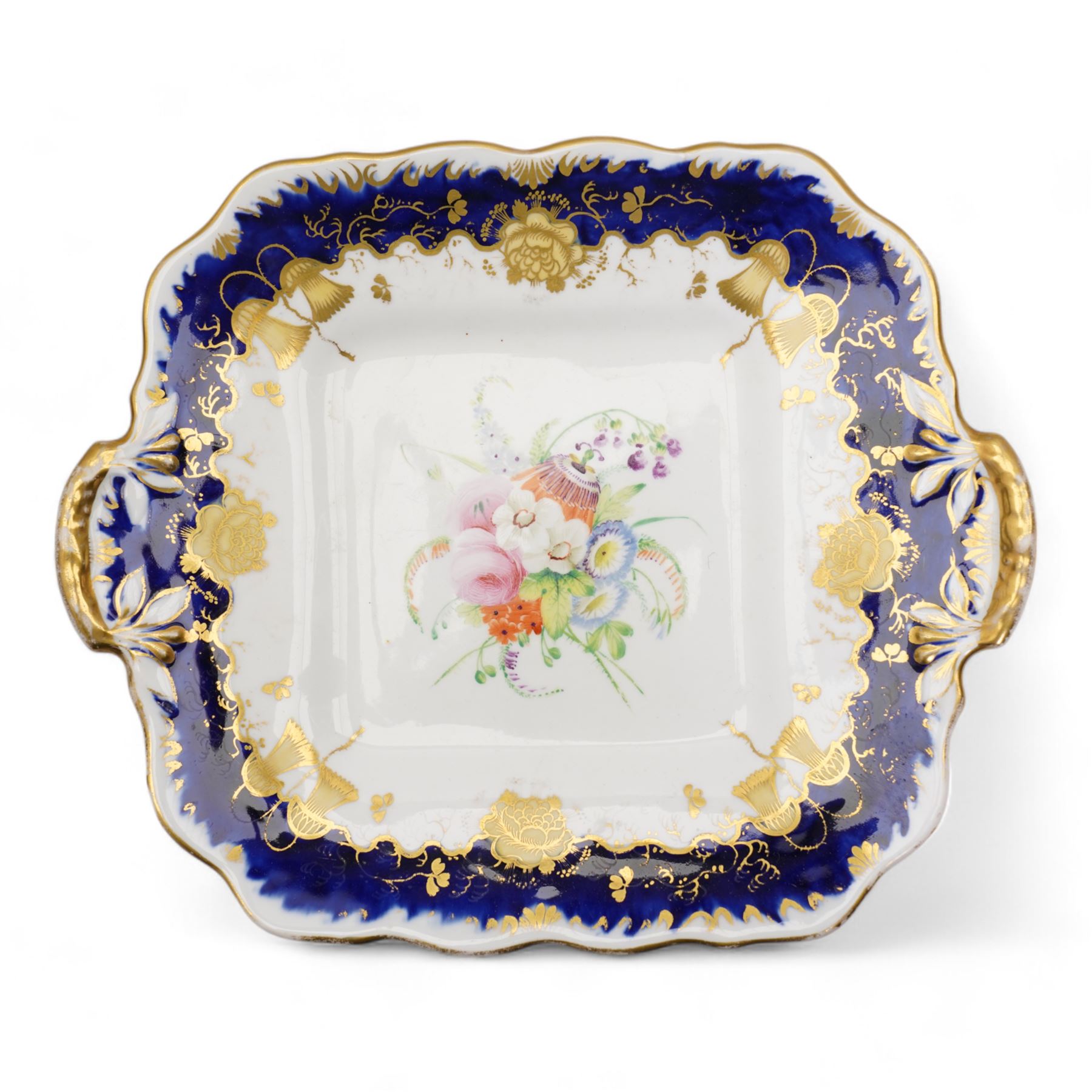 19th century porcelain part tea service, probably Spode, comprising sucrier, milk jug, sandwich plate, seven cups and two saucers, decorated with floral sprays, within cobalt blue and gilt borders, pattern no. 735 