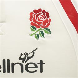 2000 England Rugby shirt sponsored by BT Cellnet, with 20 signatures from various England players, to include Martin Johnson, Mike Catt, Charlie Hodgson, Will Greenwood, Jason Leonard, and others, framed and glazed, overall 106cm x 95cm 