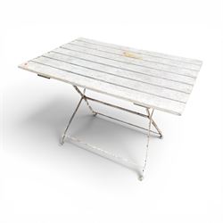 Wrought metal folding garden table, with painted wood plank top; and four matching folding chairs