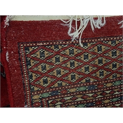  Bokhara red ground rug, geometric pattern field, repeating border, 244cm x 155cm  