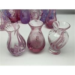 Collection of pink/purple Caithness glass vases, to include mottled and swirl designs, largest 20cm (19)