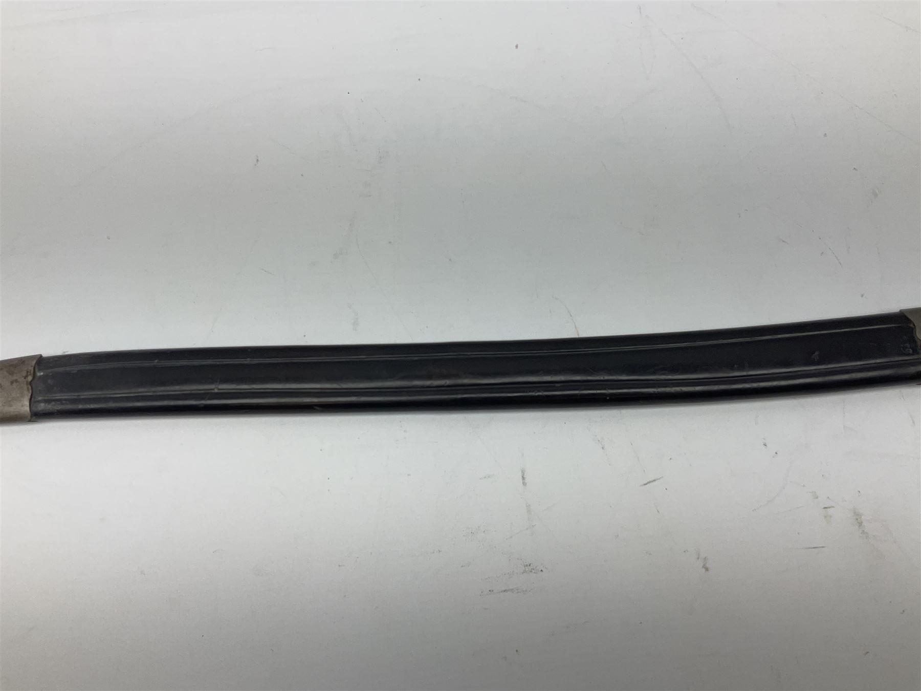 Turkish Model 1874 sword bayonet with 57.5cm curving steel fullered blade and chequered black grip, in steel mounted leather scabbard L75.5cm overall