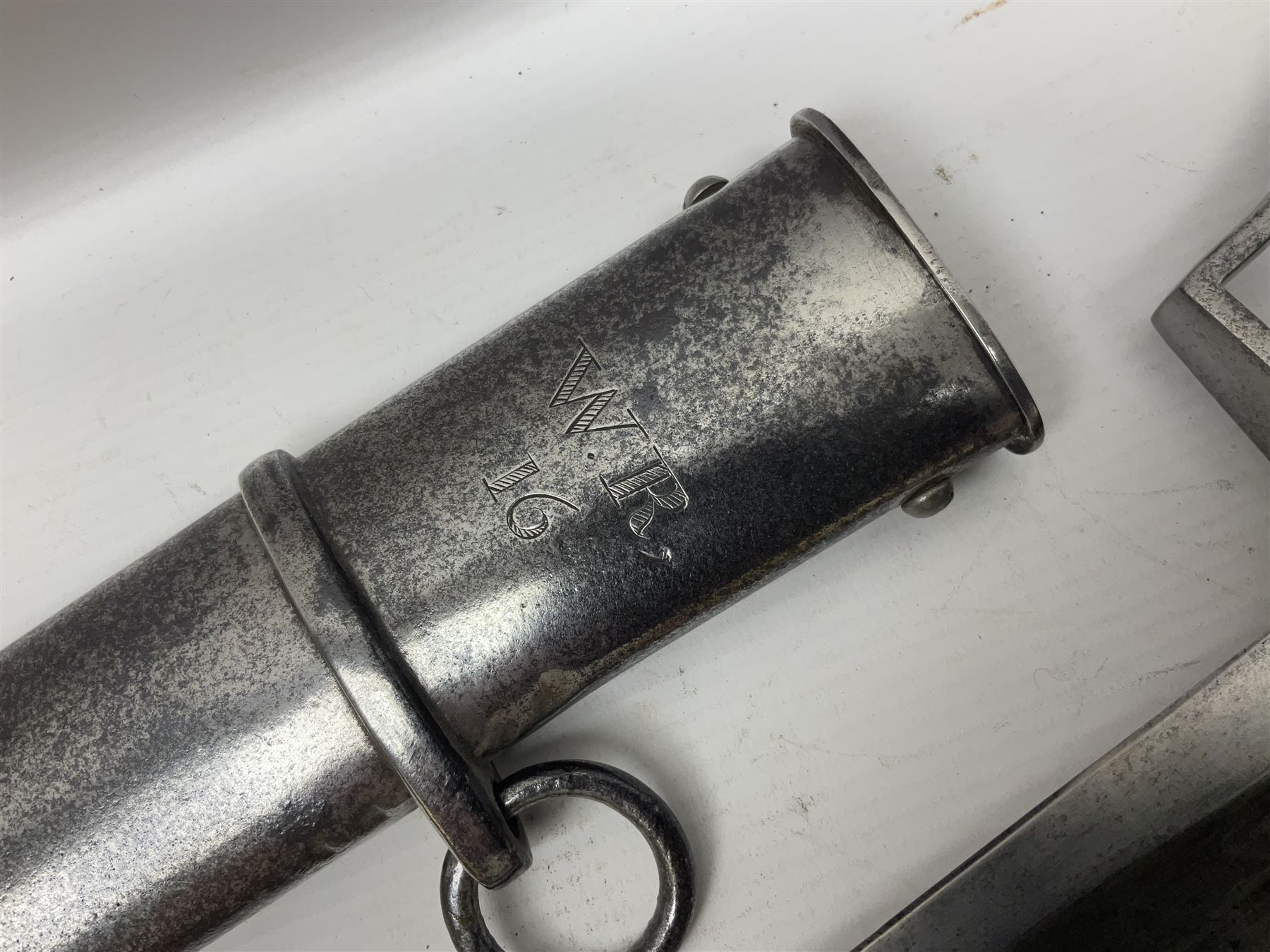 British 1796 Pattern Light Cavalry trooper's sword, the 84cm curving fullered blade stamped Hadley.1 to the back edge, steel hilt with knucklebow, D-shaped langets and leather grip; in polished steel scabbard stamped Osborn & Gunby Birmm. and W.R.16 ( ?16th Light Dragoons) with two suspension rings L100cm overall