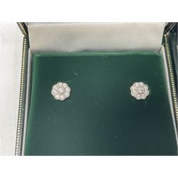 Pair of silver cubic zirconia flower cluster stud earrings and a pair of silver marcasite and pearl pendant stud earrings, both stamped 925 and boxed 