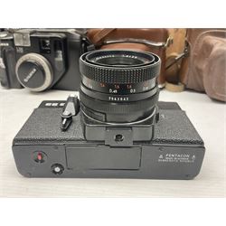 Collection of cameras and lenses, to include Pentax Program A camera body, serial no 123759, with 'Pentax-A zoom 1:3.5-4.5 28-80mm' len, Praktica EE2 camera body with 'Pentacon electric 1.8/50' lens etc, together with a Manfrotto tripod 