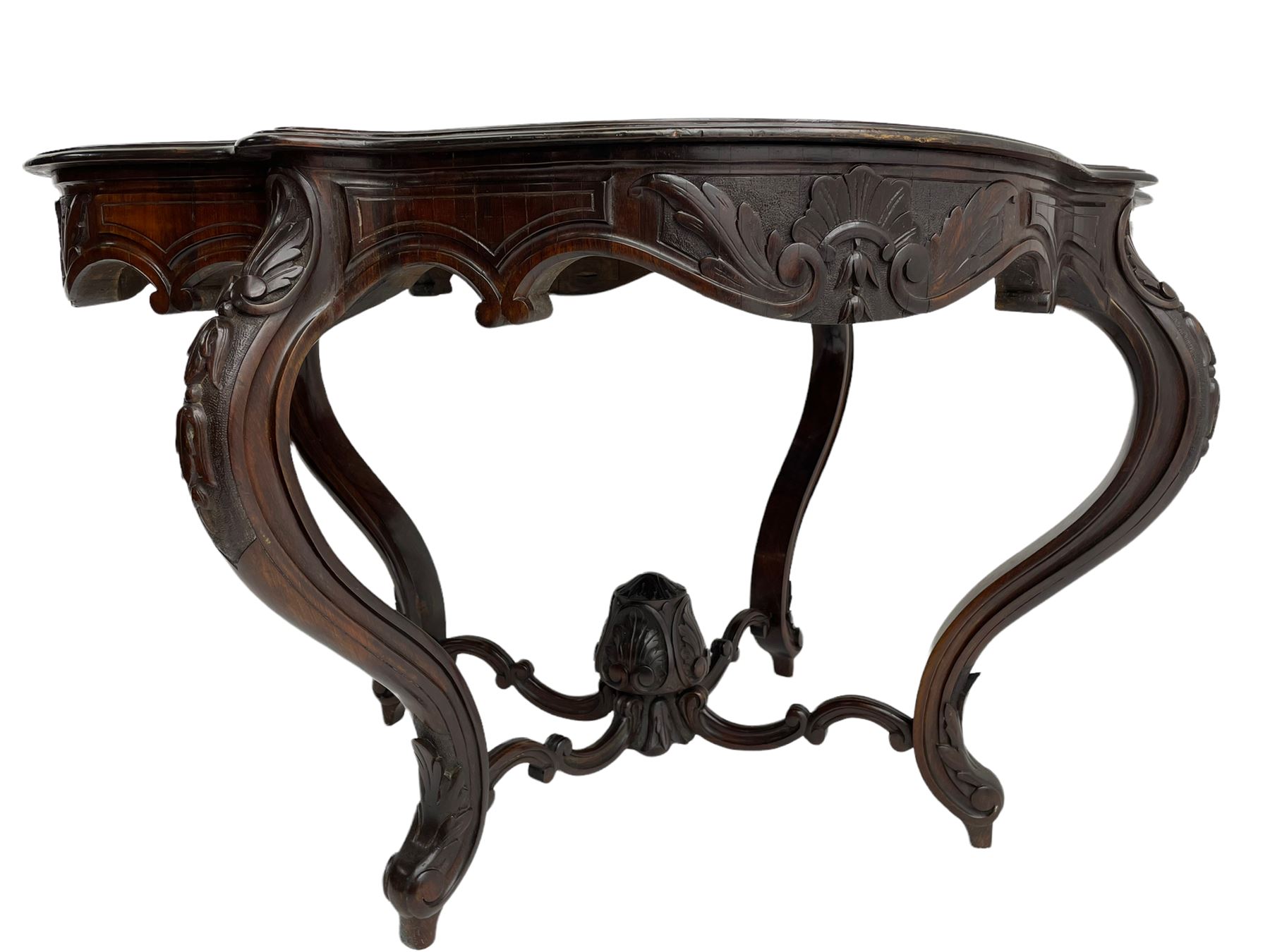 19th century Irish rosewood centre table, the shaped and moulded top over shaped apron carved with scrolled foliage, on serpentine supports carved with bell flowers, the supports united by anthemion carved finial and s-scroll x-framed stretchers