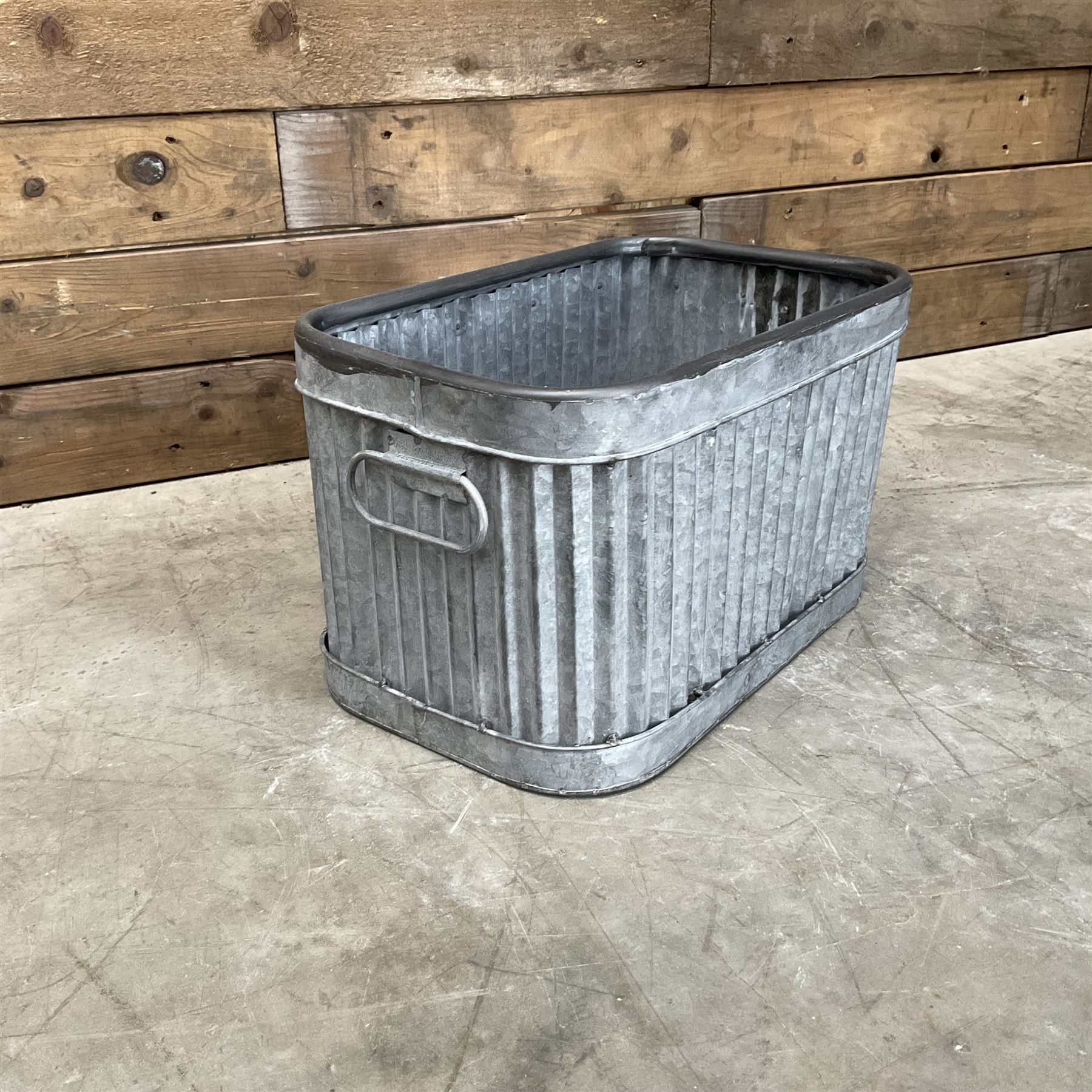 Set of three pressed metal planters in different sizes