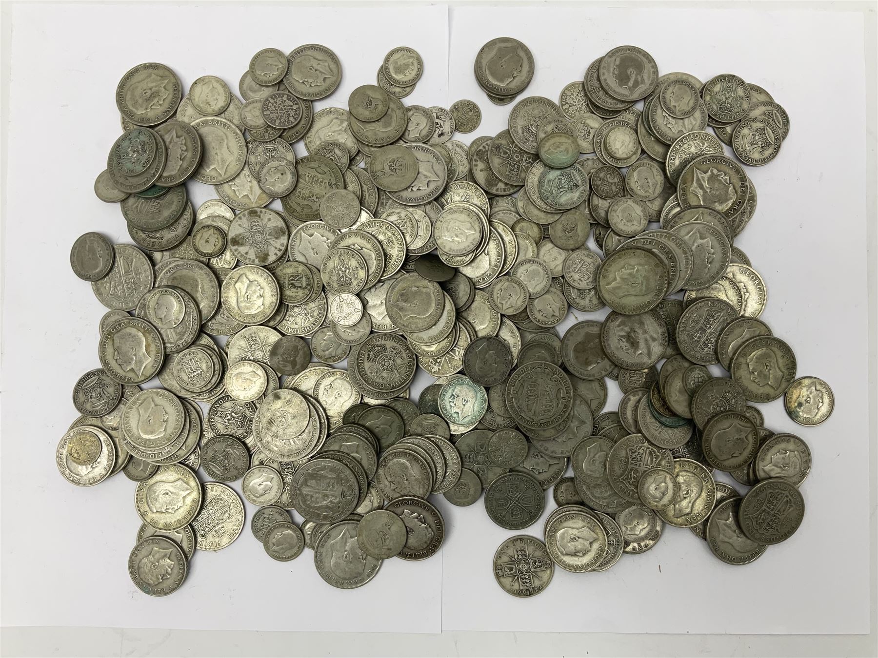 Approximately 2702 grams of Great British pre 1947 silver coins