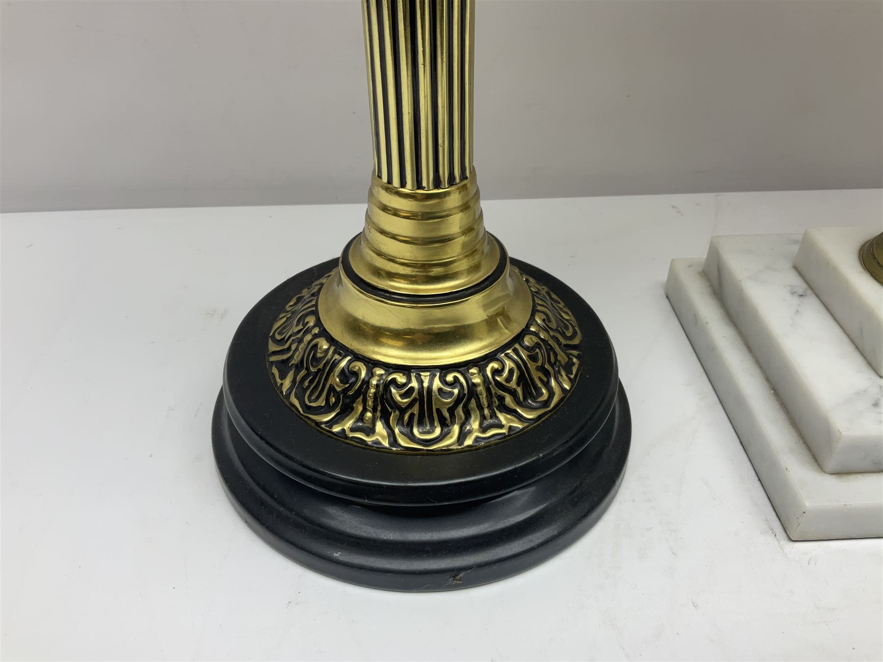 Brass Corinthian column oil lamp, upon stepped marble base, together three other brass table lamps, tallest H68cm