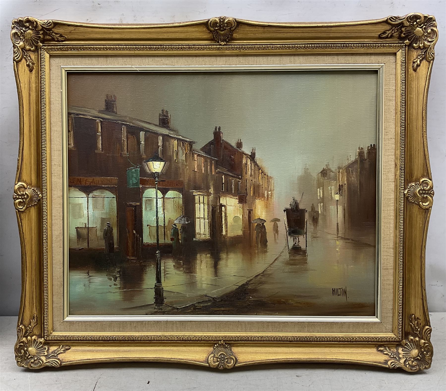 Barry Hilton (British 1941-): Edwardian Street Scene at Night, oil on canvas signed 39cm x 49cm 