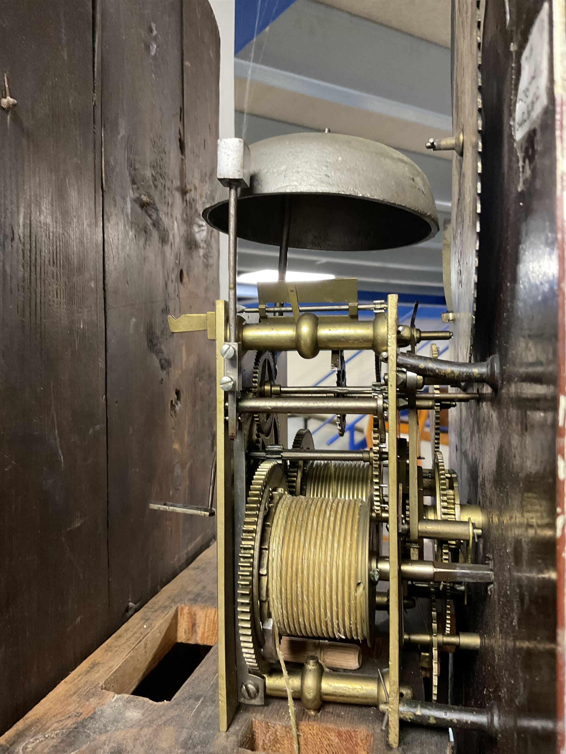 William Underhill of Newport (Shropshire) - Early 19th century mahogany longcase clock c1820,  with a swans necked pediment and inlaid paterae, break arch hood door flanked by reeded pilasters with Corinthian capitals, trunk with quarter columns and a wavy topped door, square plinth with inlay raised on a shaped plinth, painted dial with floral spandrels and moon phase disc to the arch, Arabic numerals and matching steel hands with subsidiary date and seconds hand, dial pinned directly to an 8-day rack striking movement, sounding the hours on a cast bell. With pendulum, weights and key.