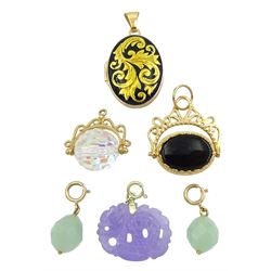 Gold carnelian and onyx swivel pendant, gold crystal swivel pendant, two hardstone charms with gold clasps, gold locket with enamel leaf decoration, all 9ct and a carved lavender jade dragon charm with 14ct gold spring loaded clasp, stamped 585
