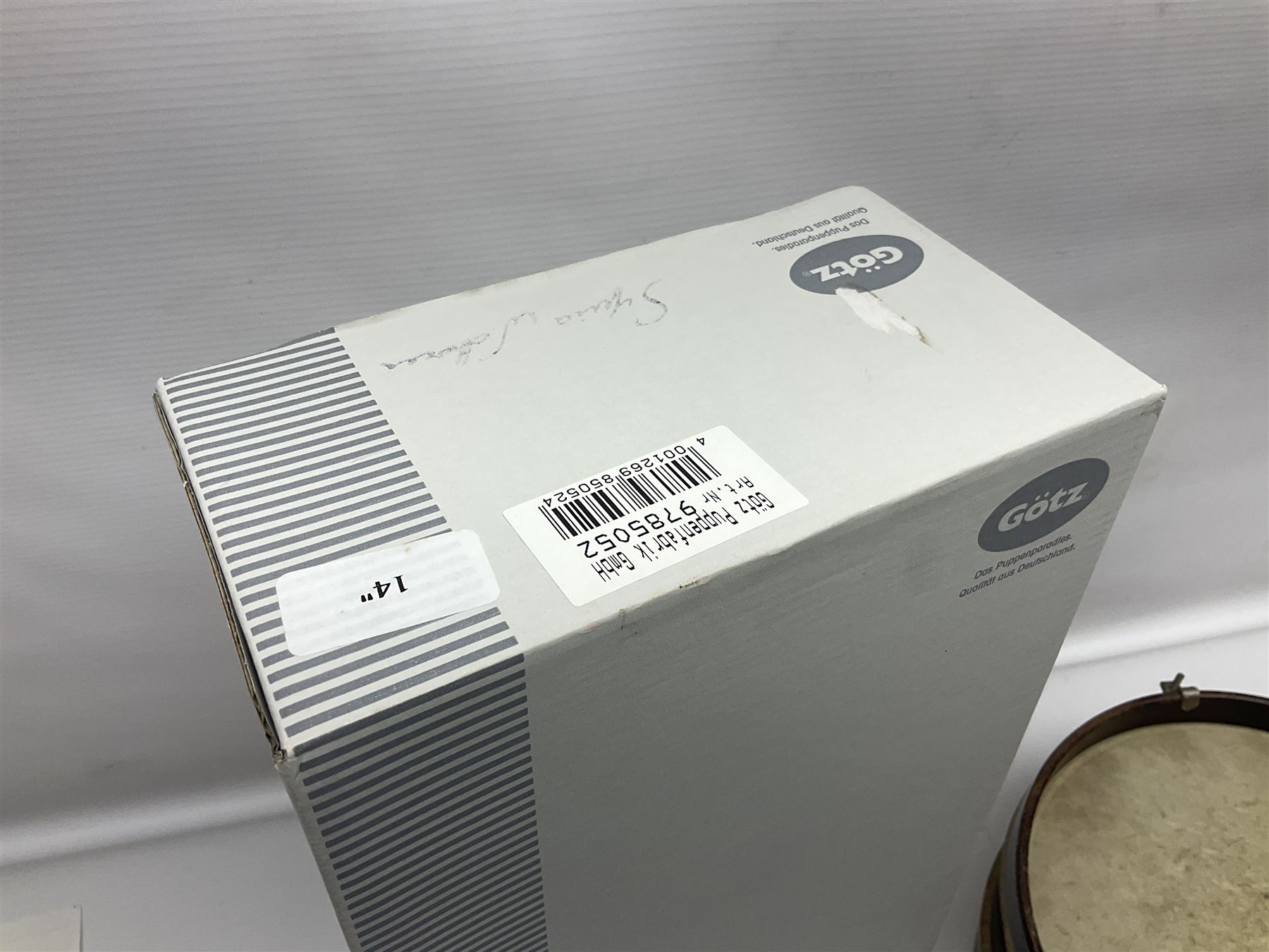 German Gotz articulated vinyl baby doll 'Claire' c1997 with original clothing, hat and labels; artist designed by Sylvia Natterer H35cm; boxed; and small child's wooden cased drum (2)