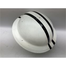WW2 Home Front 'Police' black painted steel helmet with original liner and webbing chin strap, impressed R.O. Co. 1/1939; and re-painted shell only for WW2 Wardens steel helmet impressed AMC II 1941 C676 (2)