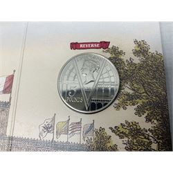 The Royal Mint United Kingdom 1984 brilliant uncirculated coin collection, 1997 and 2001 commemorative crown coins, 1997 old round one pound, all in card folders and four sterling silver medallic first day covers from the 'Great Britons' collection housed in a blue folder