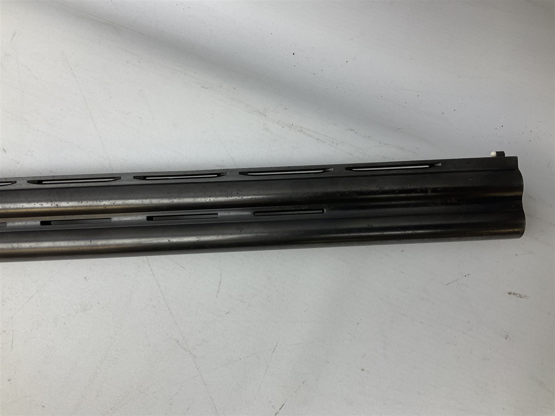 Winchester Japan 5500 12-bore by two-and-three quarters over-and-under double barrel boxlock ejector sporting gun, with 71cm barrels, ventilated rib and barrels, the walnut stock with chequered pistol grip and fore-end, single selective trigger and top safety, serial no.K542927E, L115cm overall; in gun sling SHOTGUN CERTIFICATE REQUIRED