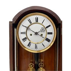 Lenzkirch – 8-day walnut cased weight driven Vienna regulator manufactured 1877-1878, with a break-arch pediment surmounted by a turned finial on a raised cavetto molding, fully glazed arched  door flanked by long ring turned pendants, flat base with open fretwork and two short pendants,  two piece enamel dial within a brass slip, Roman numerals, minute track and pierced steel hands, wooden pendulum with a brass faced bob, two brass cased weights and pulleys, dead beat escapement with a rack striking movement sounding the hours and half hours on a coiled gong, movement serial number 421410. 
Lenzkirch were one of Germanys most highly respected clock manufacturers of the 19th century, founded in the late 1850s the company produced movements and cases of high quality up until 1932.
