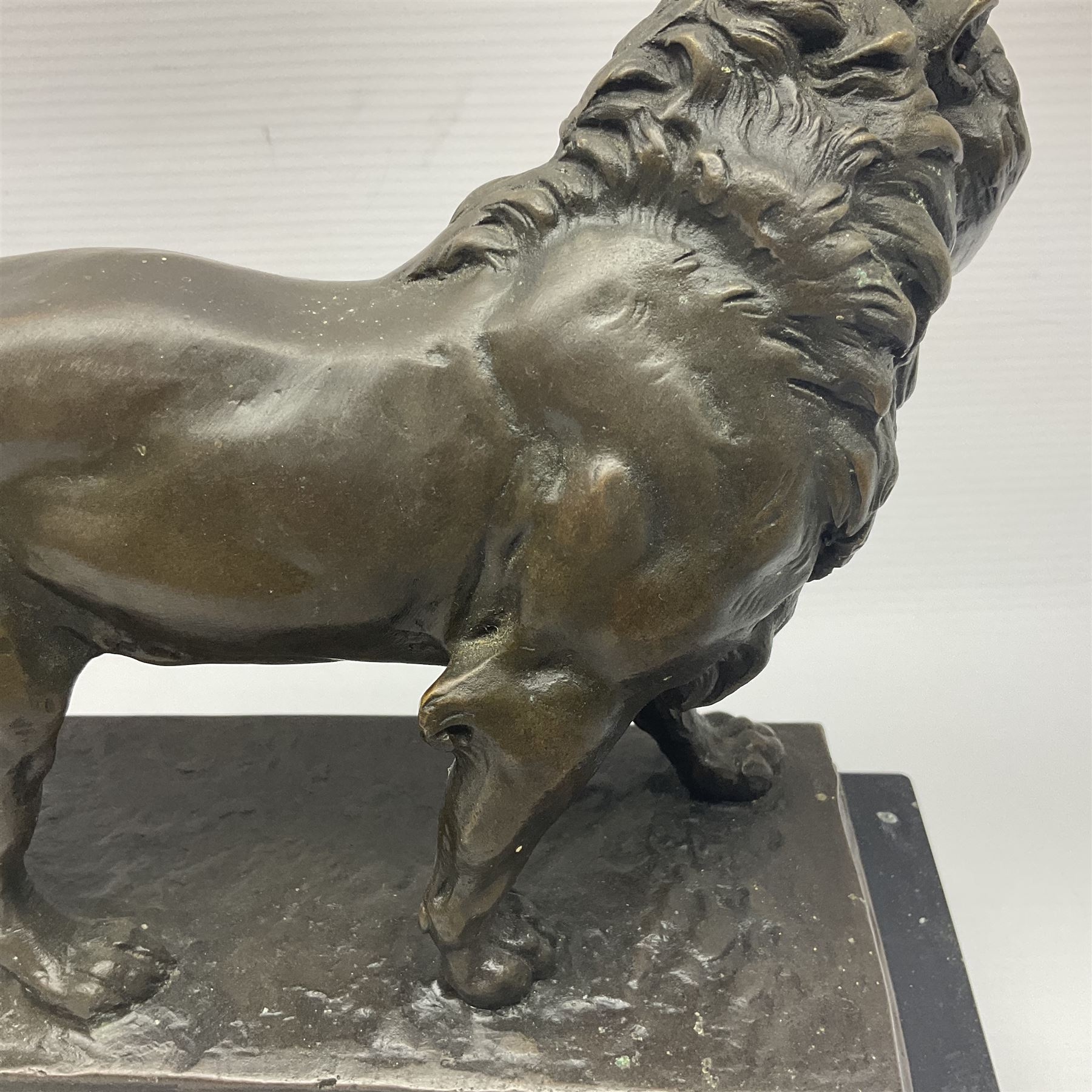 After Charles Valton, bronze, modelled as a lion, upon bronze plinth signed C H Valton, with foundry seal for J B Deposee, and black marble plinth base, overall H20cm L26cm